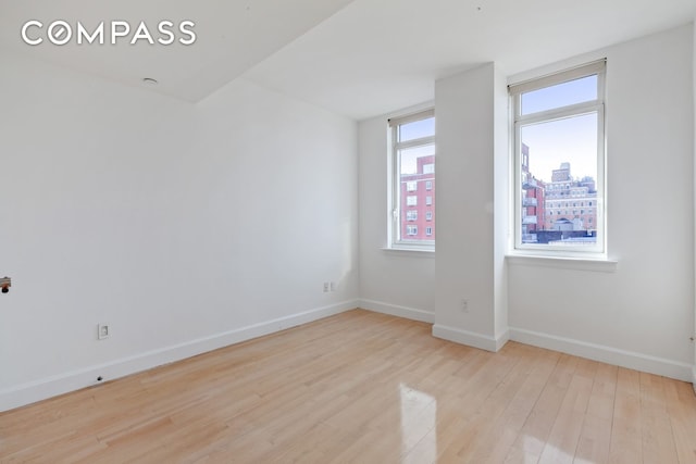2300 Frederick Douglass Blvd Unit 8D, New York City, NY 10027 - empty room with wood finished floors and baseboards