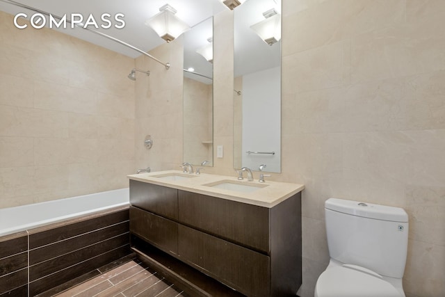2300 Frederick Douglass Blvd Unit 8D, New York City, NY 10027 - bathroom with tile walls, tiled shower / bath, and double vanity