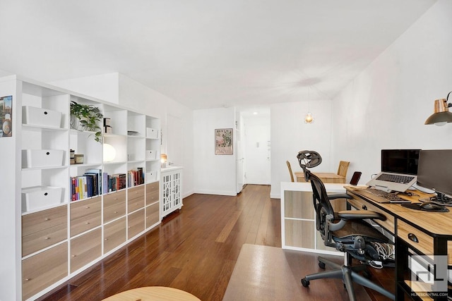 office space featuring hardwood / wood-style floors and baseboards
