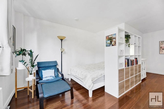 living area featuring wood finished floors and baseboards