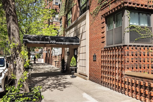 view of side of property with brick siding
