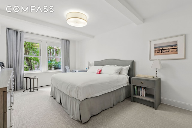 205 E 69th St Unit 3A, New York City, NY 10021 - bedroom with beamed ceiling and light carpet