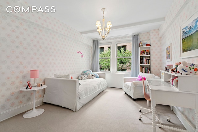 carpeted bedroom featuring wallpapered walls and a chandelier