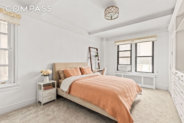 70 E 96th St Unit 2D, New York City, NY 10128 - bedroom featuring radiator heating unit, light colored carpet, and baseboards