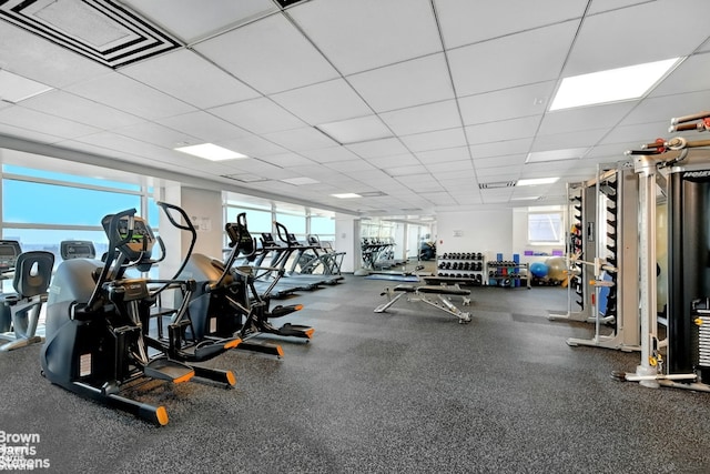exercise room featuring a drop ceiling