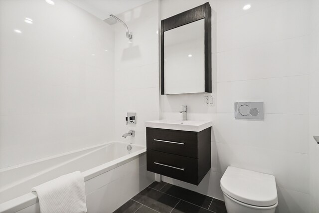 bathroom featuring shower / bathtub combination, vanity, tile patterned flooring, and toilet