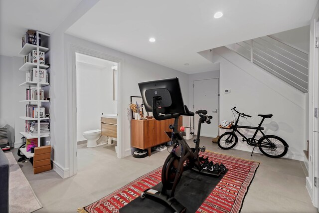 exercise area featuring recessed lighting and baseboards