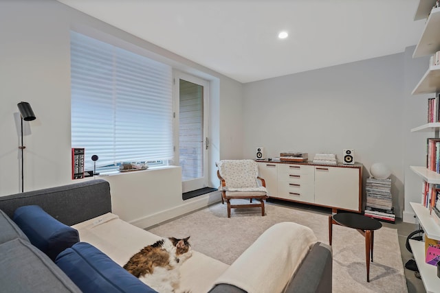 living room with baseboards and recessed lighting