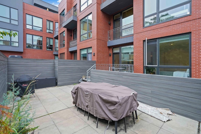 view of patio / terrace with fence and area for grilling