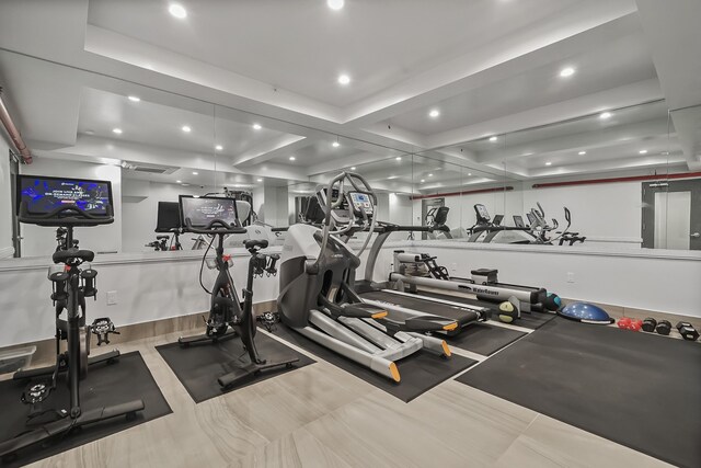 exercise room with recessed lighting