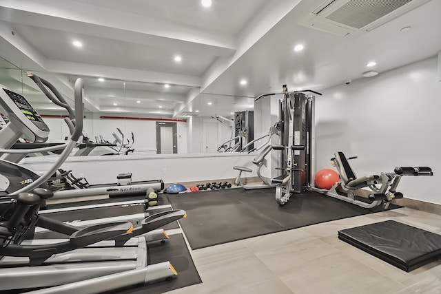 exercise room with recessed lighting