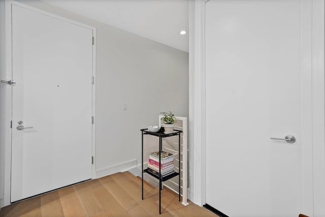 foyer featuring light wood-type flooring and recessed lighting