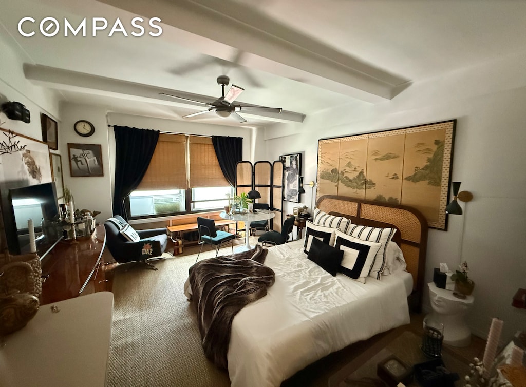 bedroom featuring ceiling fan and cooling unit