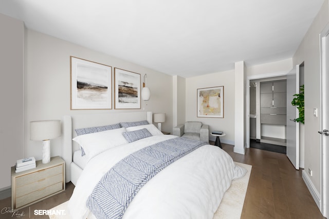 270 W 17th St Unit 12Bc, New York City, NY 10011 - bedroom featuring dark wood finished floors and baseboards