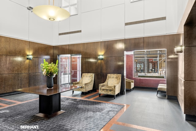 270 W 17th St Unit 12Bc, New York City, NY 10011 - lobby featuring a towering ceiling and wood walls