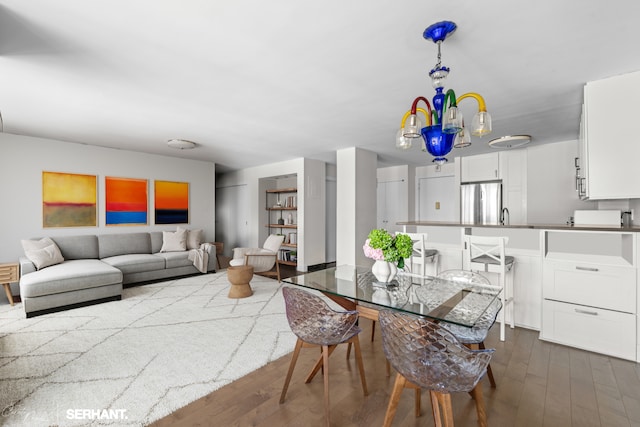 270 W 17th St Unit 12Bc, New York City, NY 10011 - dining area with dark wood-style flooring and a chandelier