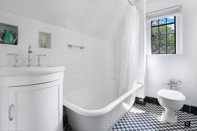 4500 Fieldston Rd, New York City, NY 10471 - bathroom featuring vanity, toilet, shower / tub combo with curtain, tile walls, and tile patterned floors