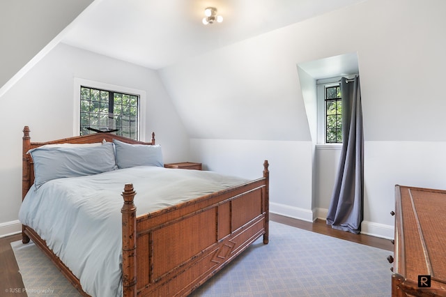 4500 Fieldston Rd, New York City, NY 10471 - bedroom with dark wood finished floors, vaulted ceiling, and baseboards