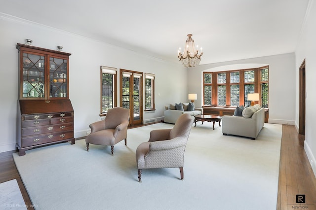 4500 Fieldston Rd, New York City, NY 10471 - living area featuring a chandelier, crown molding, baseboards, and light wood-style flooring