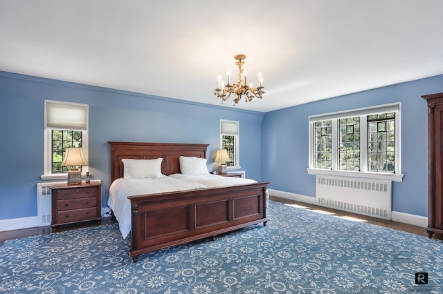 4500 Fieldston Rd, New York City, NY 10471 - bedroom featuring radiator, a chandelier, baseboards, and multiple windows