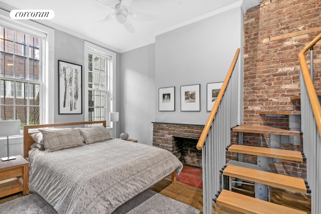 352 W 12th Street Maisonette, New York City, NY 10014 - bedroom with a brick fireplace, ornamental molding, and ceiling fan