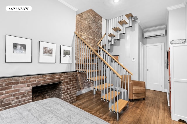 352 W 12th Street Maisonette, New York City, NY 10014 - stairs featuring a wall mounted air conditioner, ornamental molding, hardwood / wood-style flooring, a brick fireplace, and brick wall