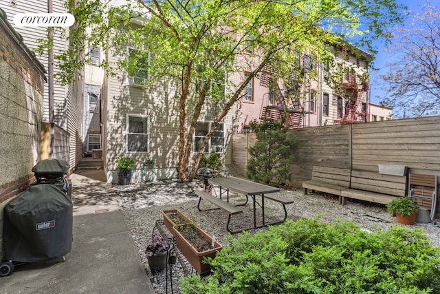 251 Powers St, New York City, NY 11211 - fenced backyard featuring a patio