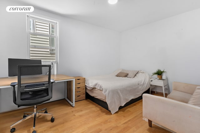 251 Powers St, New York City, NY 11211 - bedroom featuring light wood-style flooring and an office area