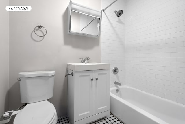 bathroom featuring toilet, tub / shower combination, and vanity