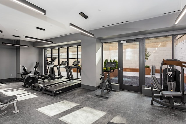 workout area featuring baseboards