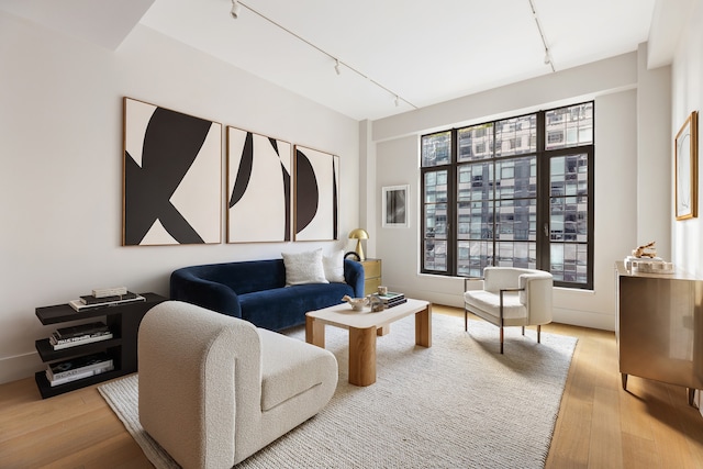 517 W 29th St Unit 3D, New York City, NY 10001 - living area with track lighting and light wood-style floors