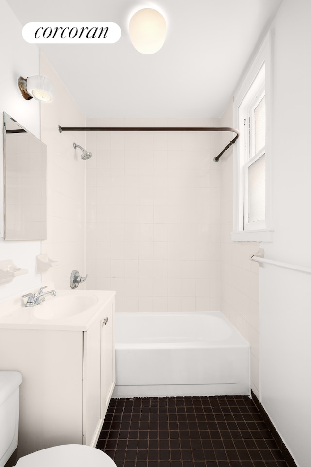 full bath with toilet, shower / washtub combination, vanity, and tile patterned floors