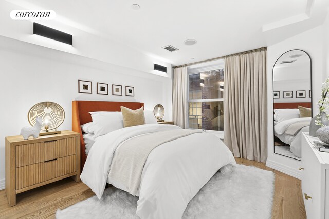 bedroom with light wood finished floors