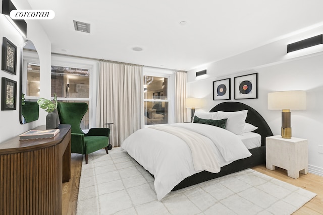 bedroom featuring wood finished floors