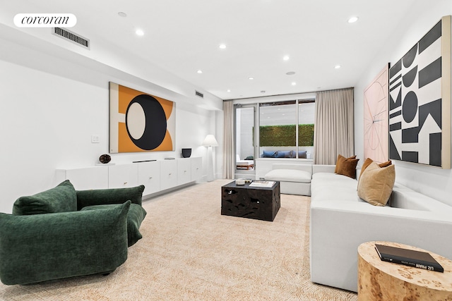 living area with recessed lighting and carpet floors