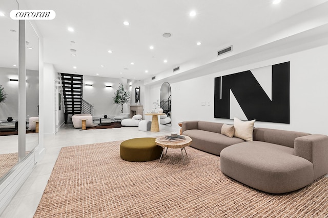 common area with stairs and recessed lighting
