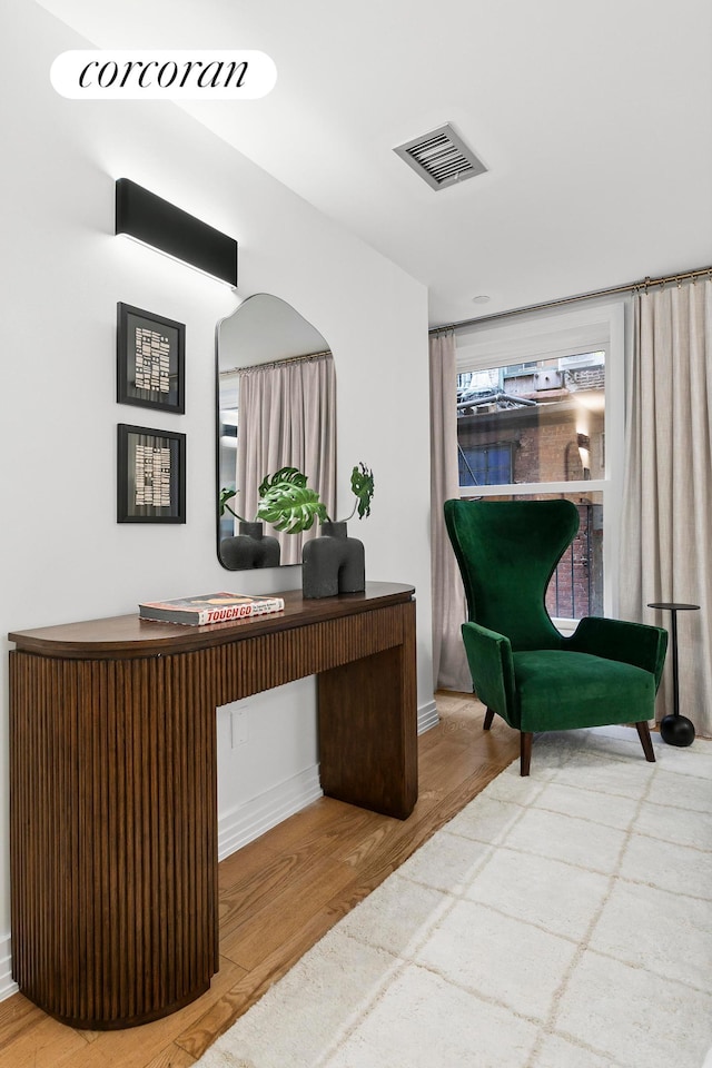 office area featuring wood finished floors and baseboards