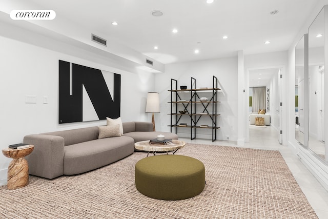 living room featuring recessed lighting, light tile patterned floors, and baseboards