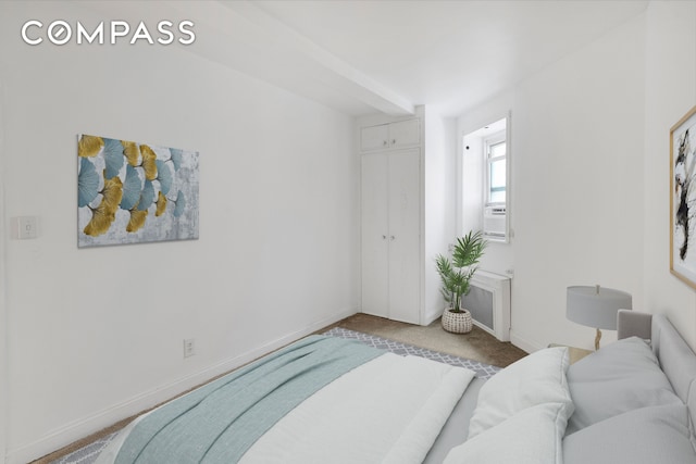 61 E 77th St Unit 5F, New York City, NY 10075 - bedroom with carpet flooring, baseboards, and a closet