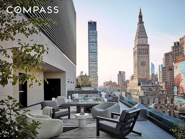 view of patio / terrace featuring an outdoor hangout area and a view of skyline