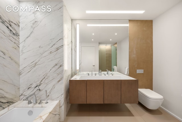 bathroom with a bath, toilet, and double vanity