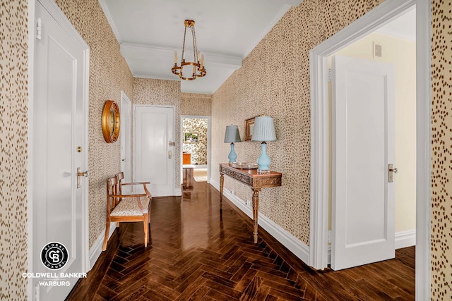 215 E 72nd St Unit 12E, New York City, NY 10021 - hallway featuring wallpapered walls, crown molding, a chandelier, and baseboards