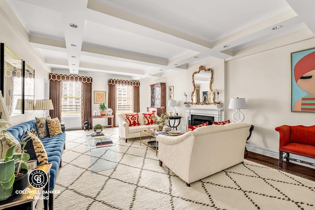 215 E 72nd St Unit 12E, New York City, NY 10021 - living area with coffered ceiling, beam ceiling, baseboards, a fireplace, and wood finished floors