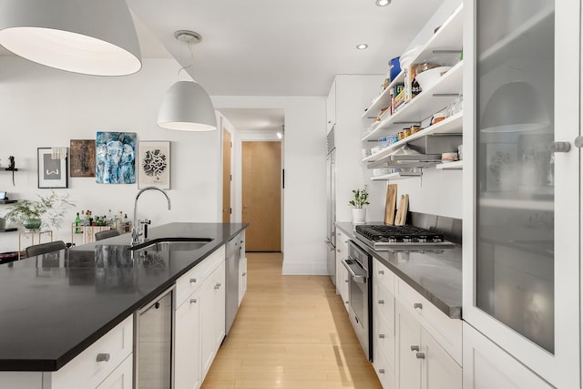 70 Washington St Unit 9A, New York City, NY 11201 - kitchen with a sink, stainless steel appliances, beverage cooler, light wood finished floors, and open shelves