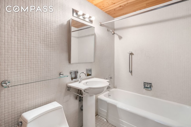 bathroom featuring tile walls, toilet, tub / shower combination, wooden ceiling, and tile patterned flooring