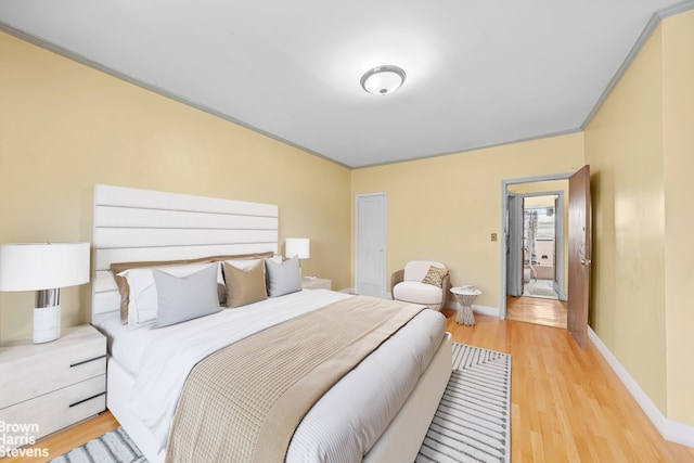 319 E 59th St, New York City, NY 11203 - bedroom with wood finished floors and baseboards