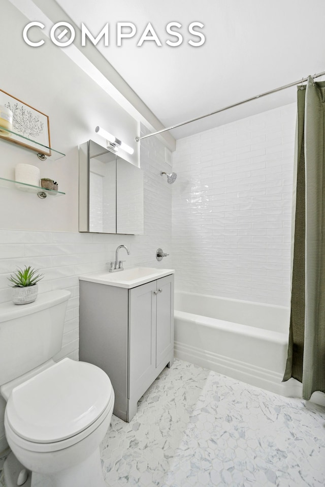 full bathroom featuring marble look tiles, shower / bath combination with curtain, toilet, and vanity