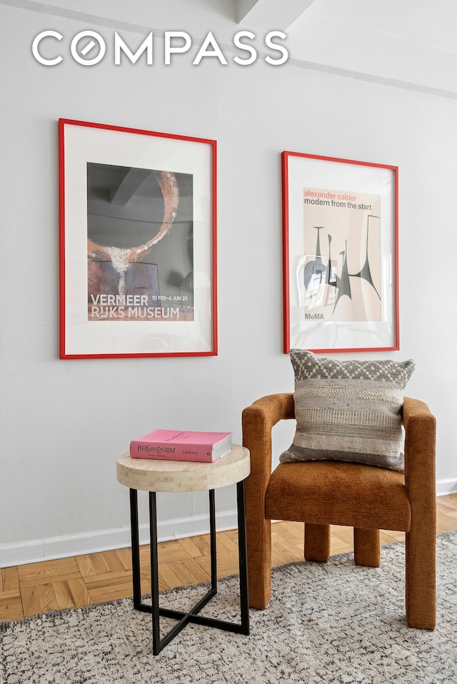 sitting room featuring baseboards