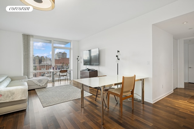living room with wood finished floors and baseboards