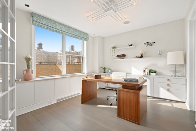 595 W End Ave Unit 9Fl, New York City, NY 10024 - office area featuring wood finished floors, a city view, and a chandelier